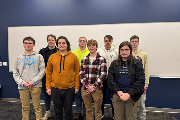 Front, From Left: David Siemienas, Ihor Makhynia, Jon Reel, Juleigh Wilson Back, From Left: Derek Manzella, Ethan Clark, Will Tilstra, Malachi Reynolds